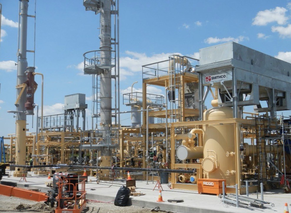 Completed liquefier skid installed in the field, painted and piped